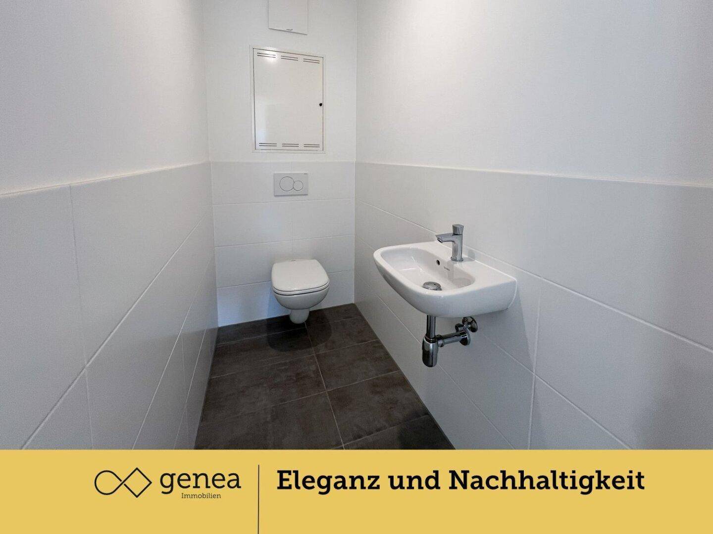 Kleines, modernes Gäste-WC mit wandhängender Toilette und Waschbecken.