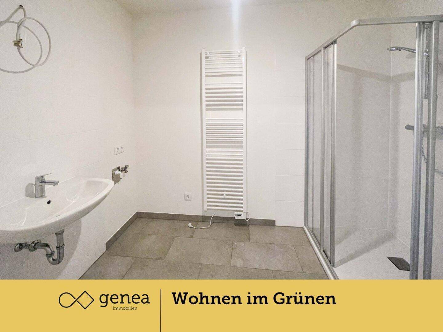 Modernes Badezimmer mit Duschkabine, Waschbecken und beheiztem Handtuchhalter.