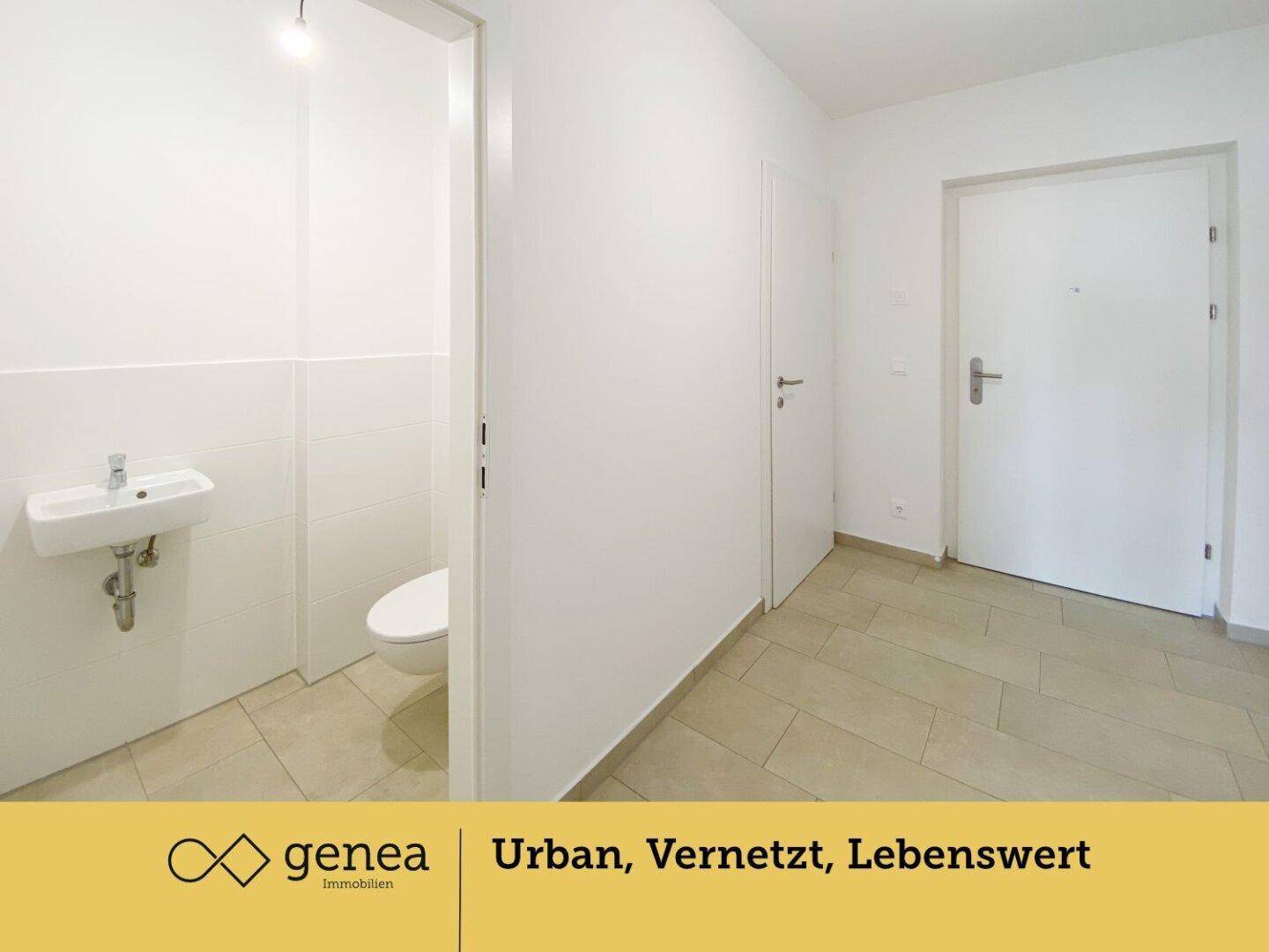 Separates Gäste-WC mit kleinem Waschbecken und wandhängender Toilette in modernem Design.