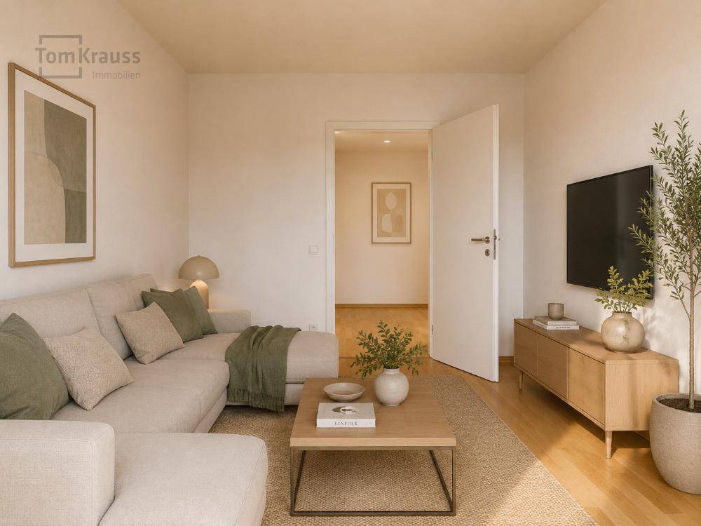 Gemütliches Wohnzimmer mit Ecksofa, Holzboden und modernem Dekor, offen zum Flur.