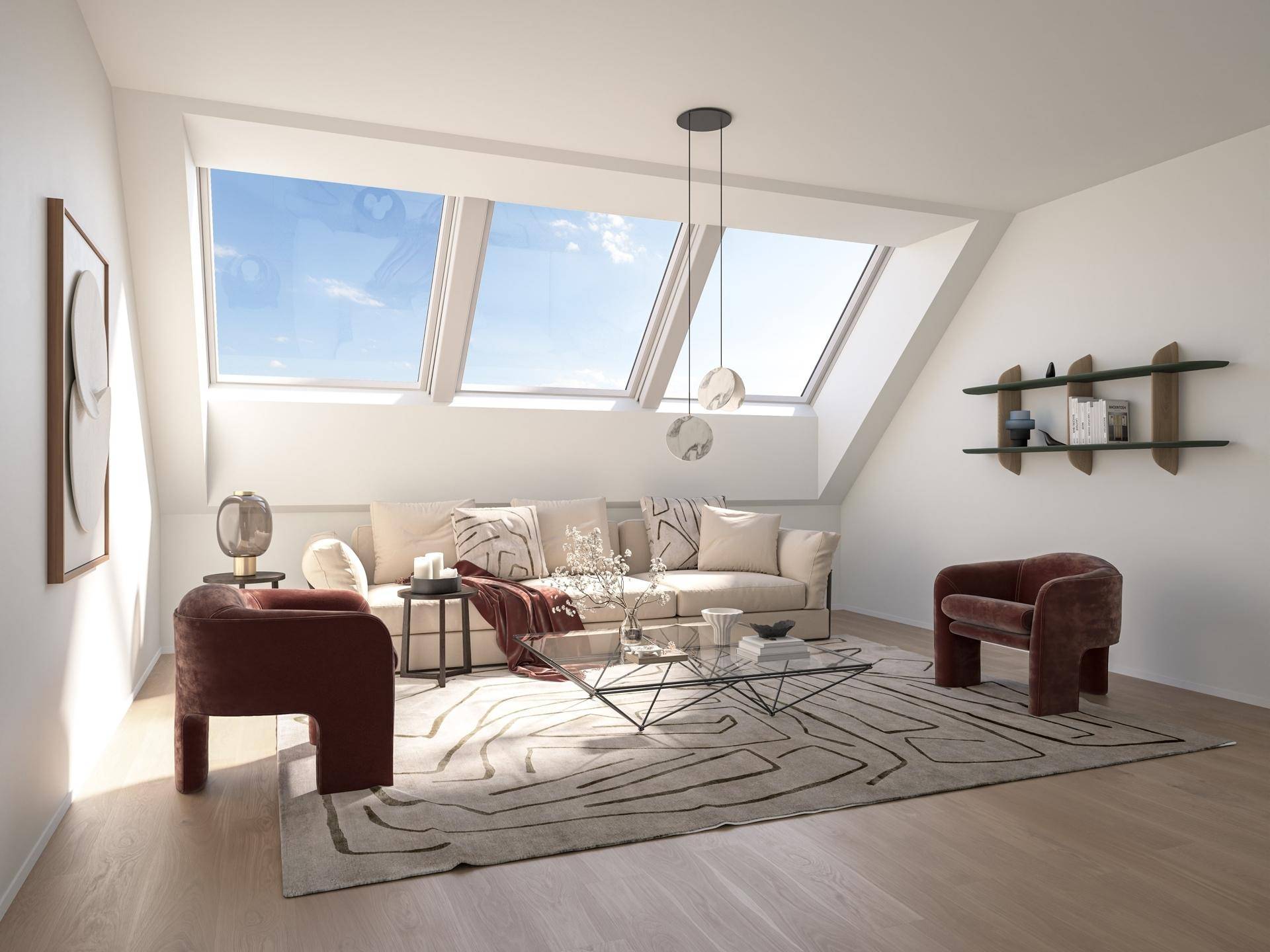 Helles Wohnzimmer im Dachgeschoss mit großen Dachfenstern, schrägen Wänden und moderner Einrichtung.