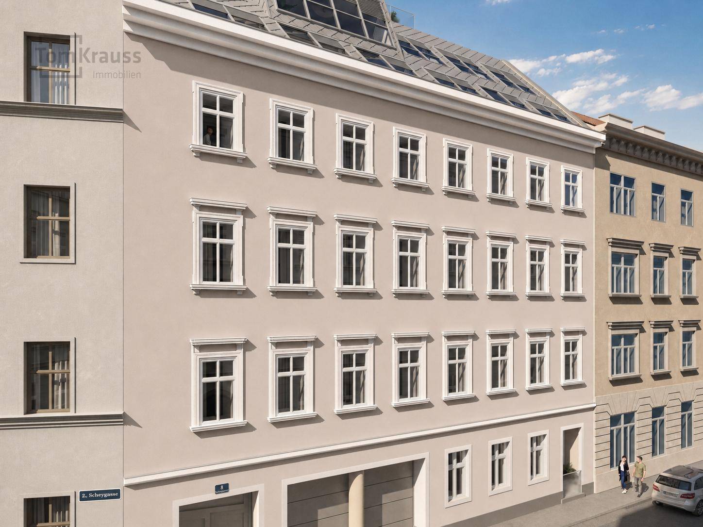 Historische Fassade eines Mehrfamilienhauses mit vielen Fenstern und klassischer Architektur.
