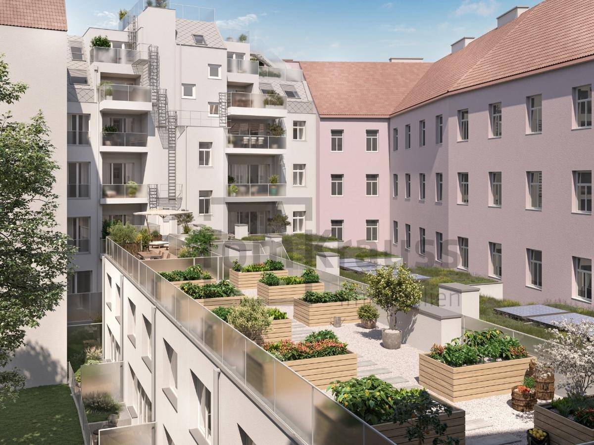 Begrünter Innenhof mit Terrassen und Dachgärten, umgeben von modernen Gebäuden.