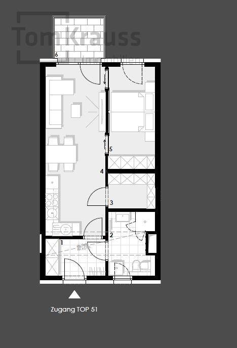 Grundriss einer Wohnung mit offenem Wohnbereich, Schlafzimmer und Balkon.