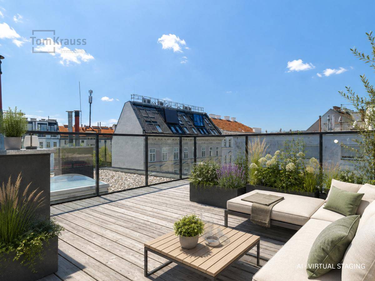 Gestaltete Dachterrasse mit Sitzgelegenheiten, Pflanzen und Blick über die Stadt.