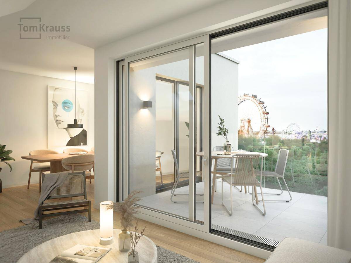 Heller Wohn- und Essbereich mit Zugang zu einer Terrasse, die einen weiten Blick bietet.