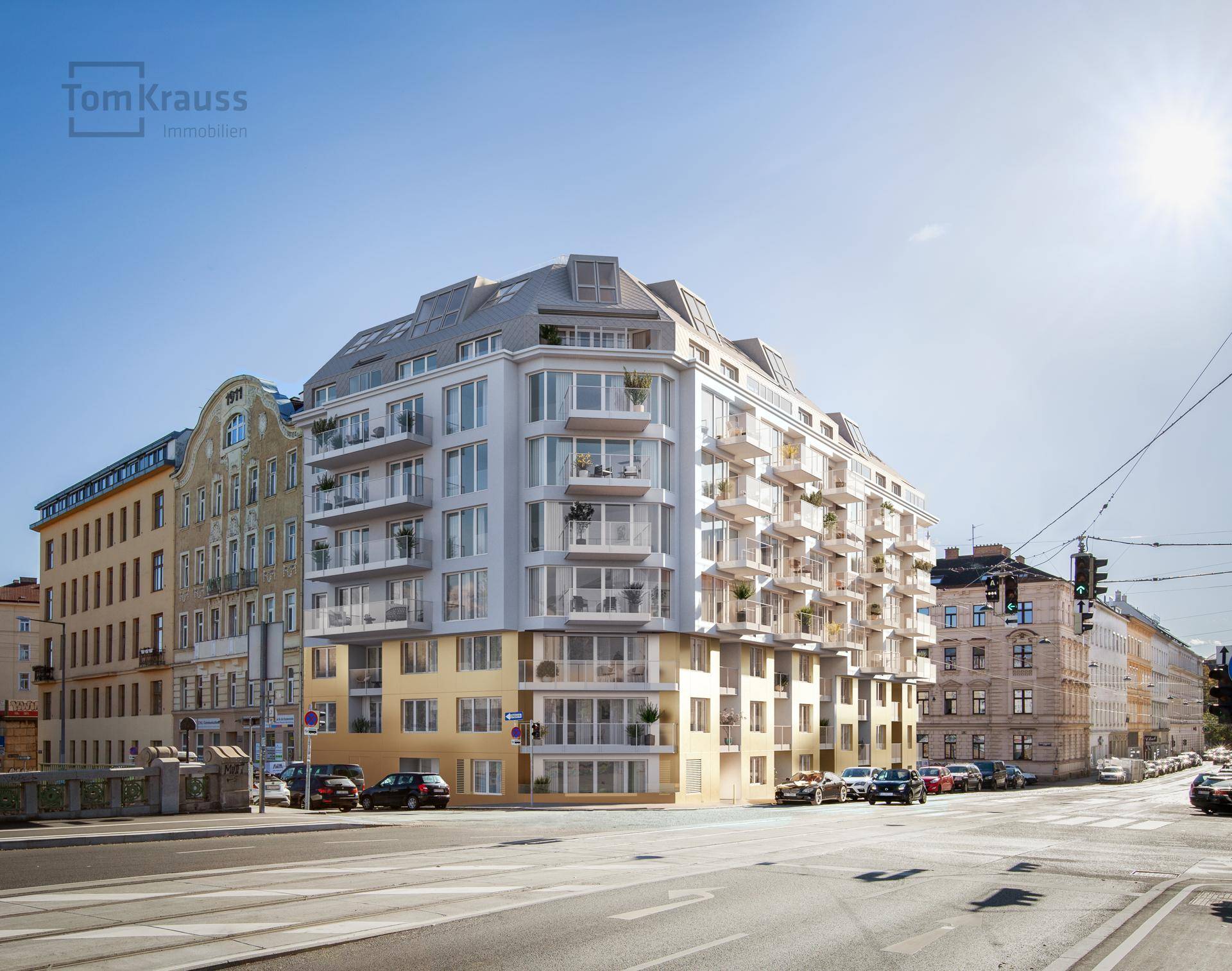 Ansicht des modernen Wohngebäudes mit goldfarbener Fassade und zahlreichen Balkonen unter blauem Himmel.
