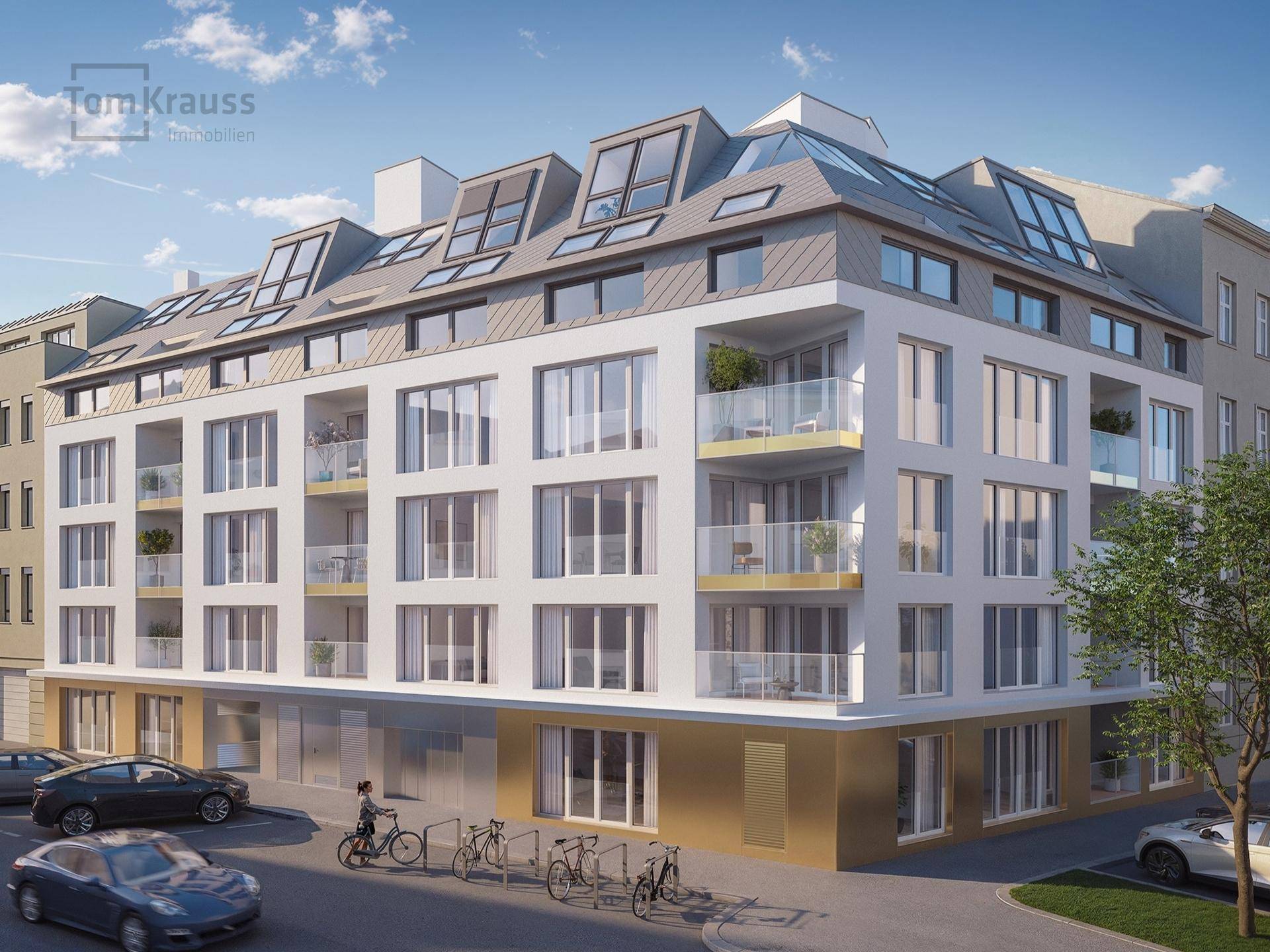 Moderne Wohnanlage mit markanter Dachkonstruktion und Balkonen an einer städtischen Straße.