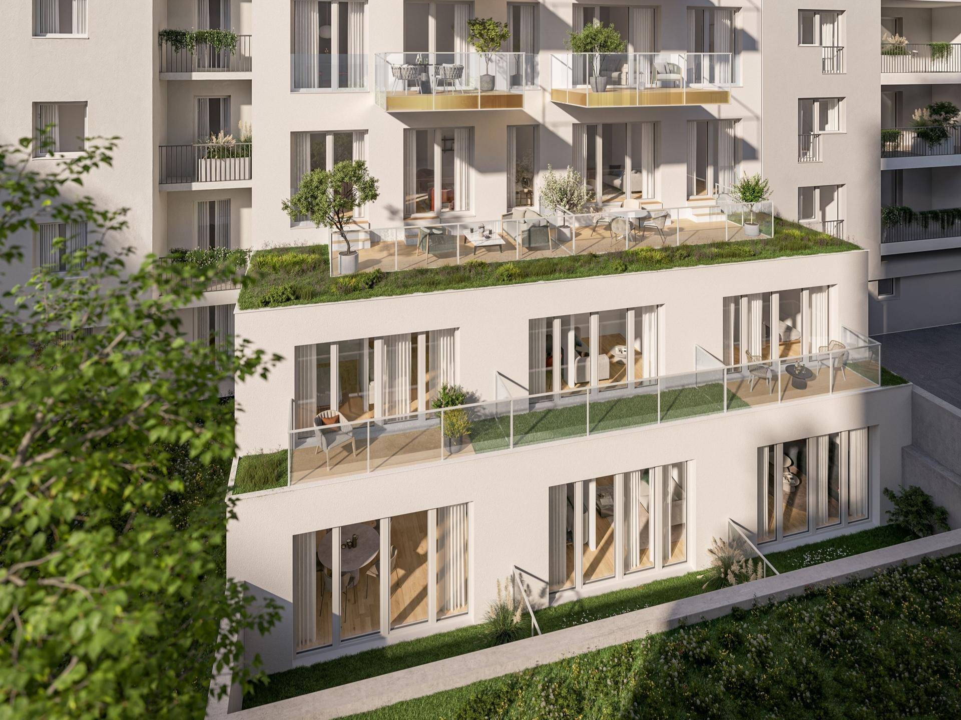 Moderne Wohnanlage mit mehreren Balkonen, Terrassen und begrünten Dächern.