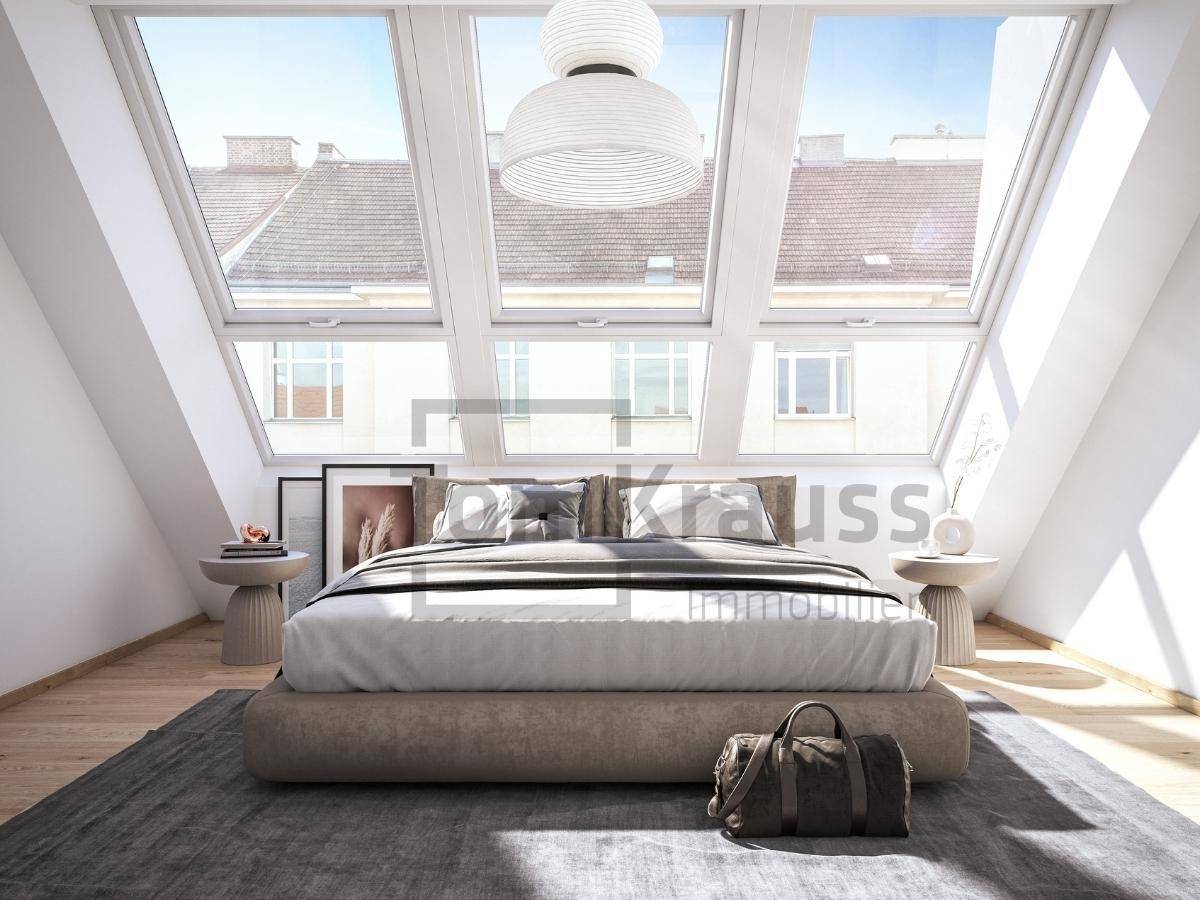 Modernes Schlafzimmer im Dachgeschoss mit großen Dachfenstern und Holzboden.