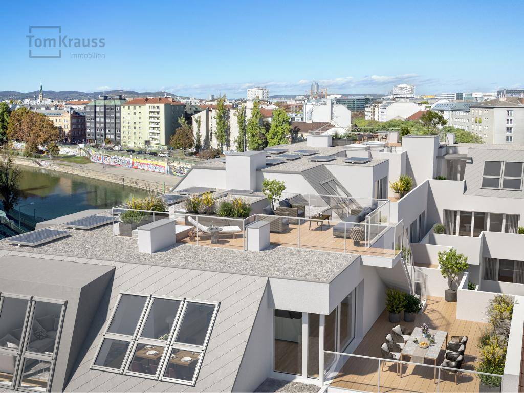 Dachlandschaft eines modernen Wohnkomplexes mit privaten Terrassen und Flussnähe.