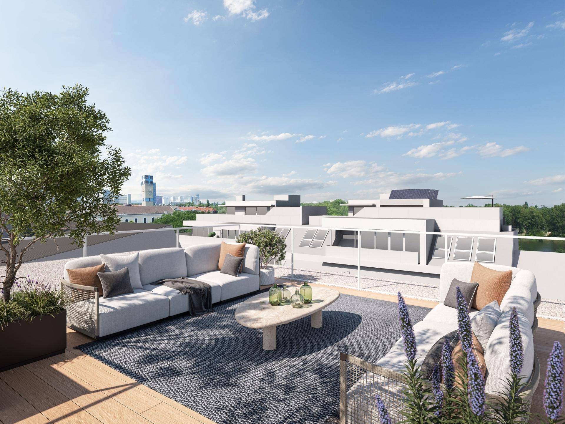 Großzügige Dachterrasse mit bequemen Loungemöbeln und weitem Blick über die Stadt.
