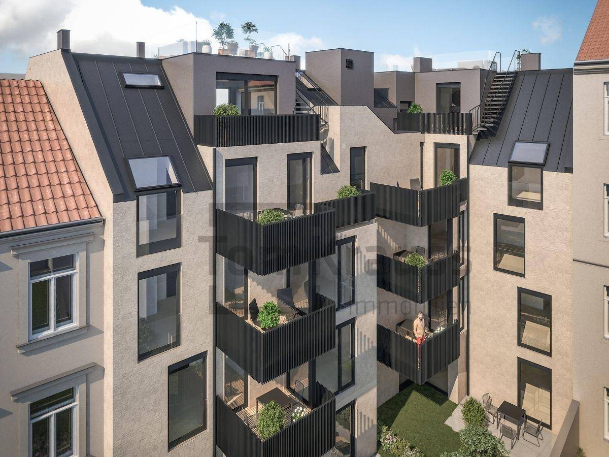 Moderne Gebäudefassade mit zahlreichen Balkonen und Dachterrassen, die urbanes Wohnen bieten.
