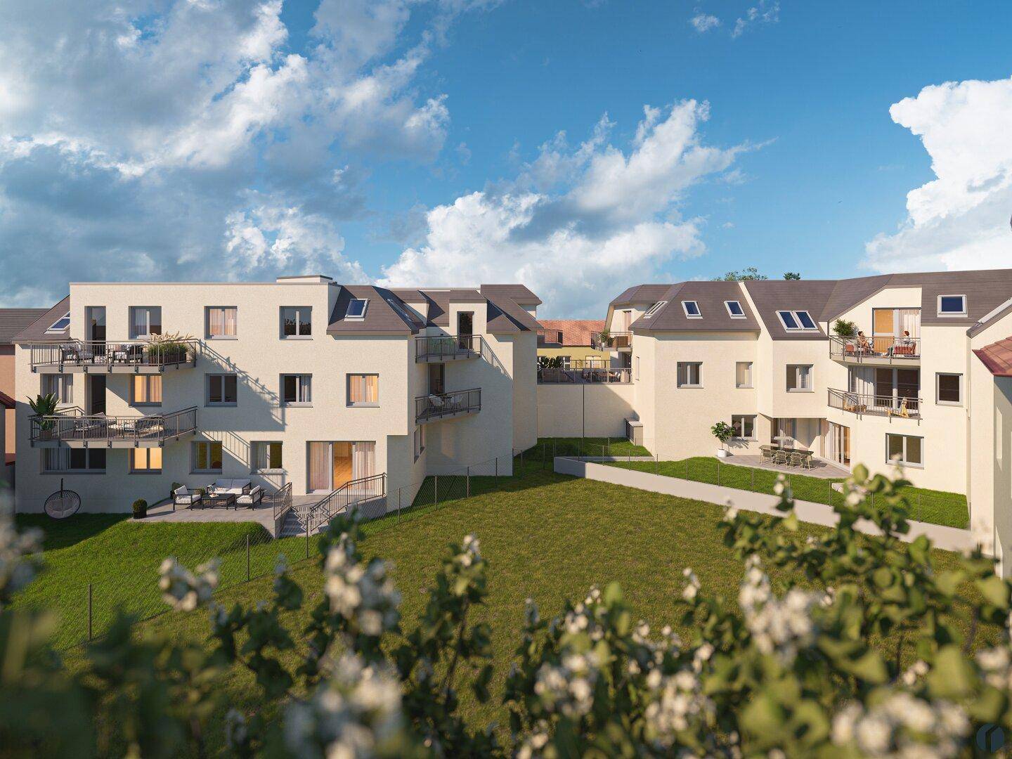 Rückansicht der Wohnanlage mit privaten Gärten, Terrassen und Balkonen.