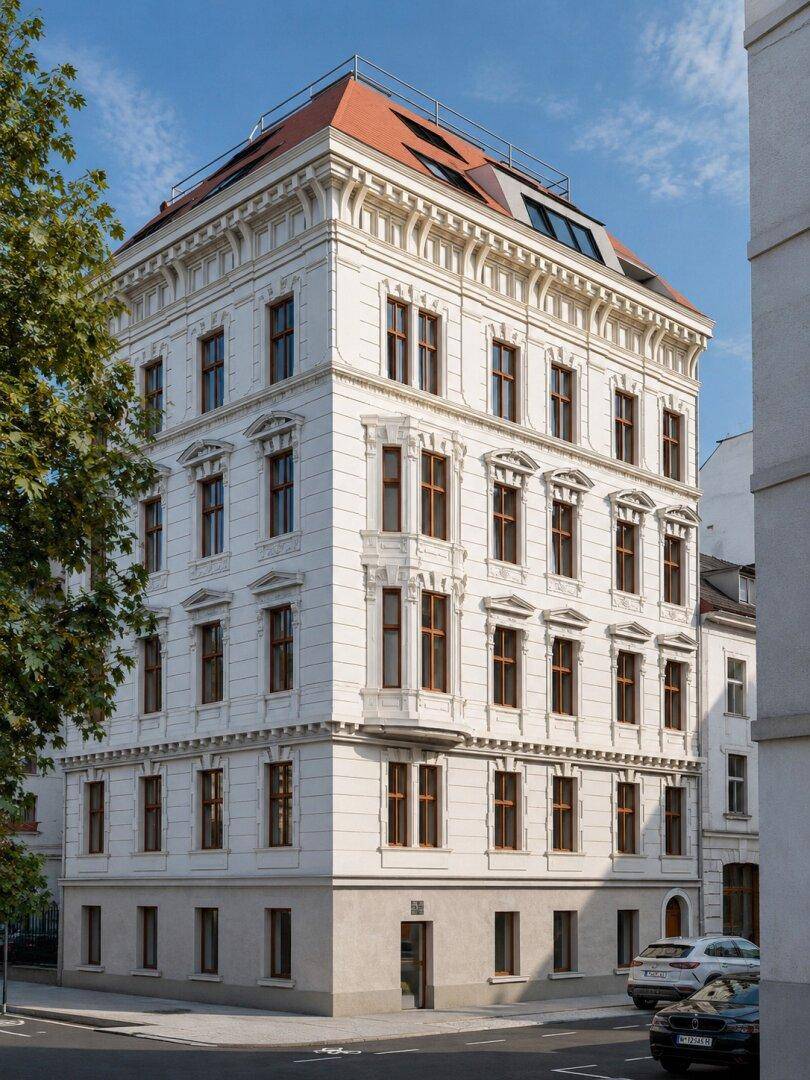 Elegantes Eckgebäude mit klassischer Architektur und modernem Dachausbau in urbaner Umgebung.