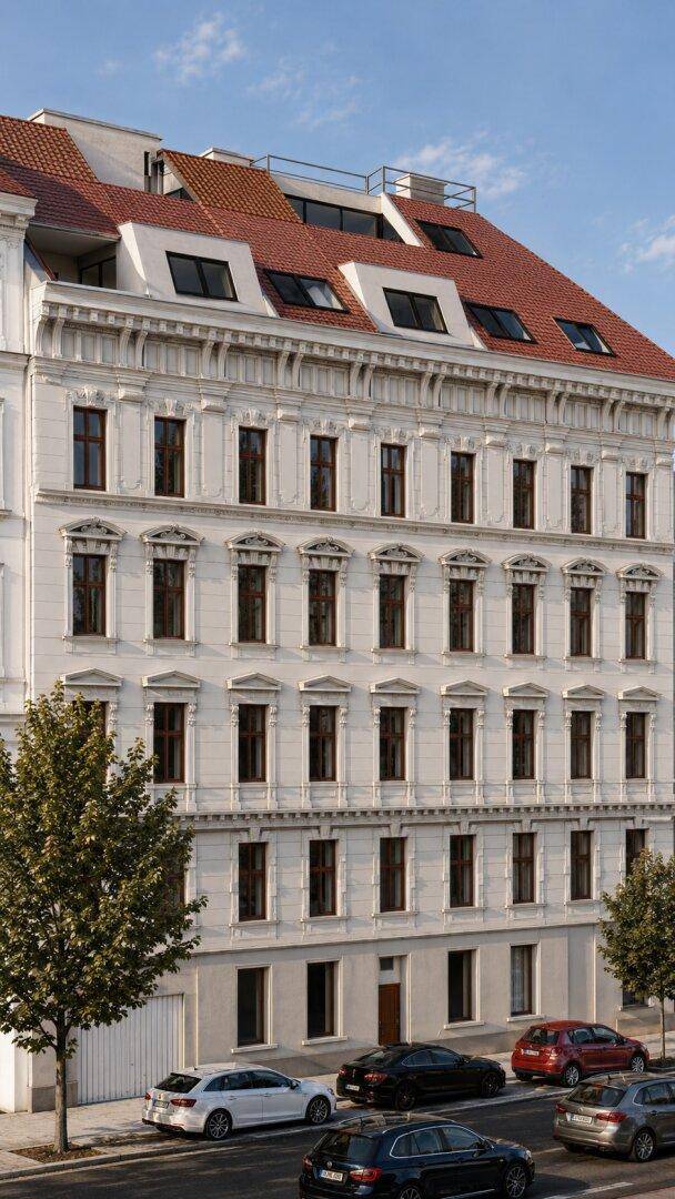 Historische Fassade eines Wohngebäudes mit vielen Fenstern und einem ausgebauten Dachgeschoss.
