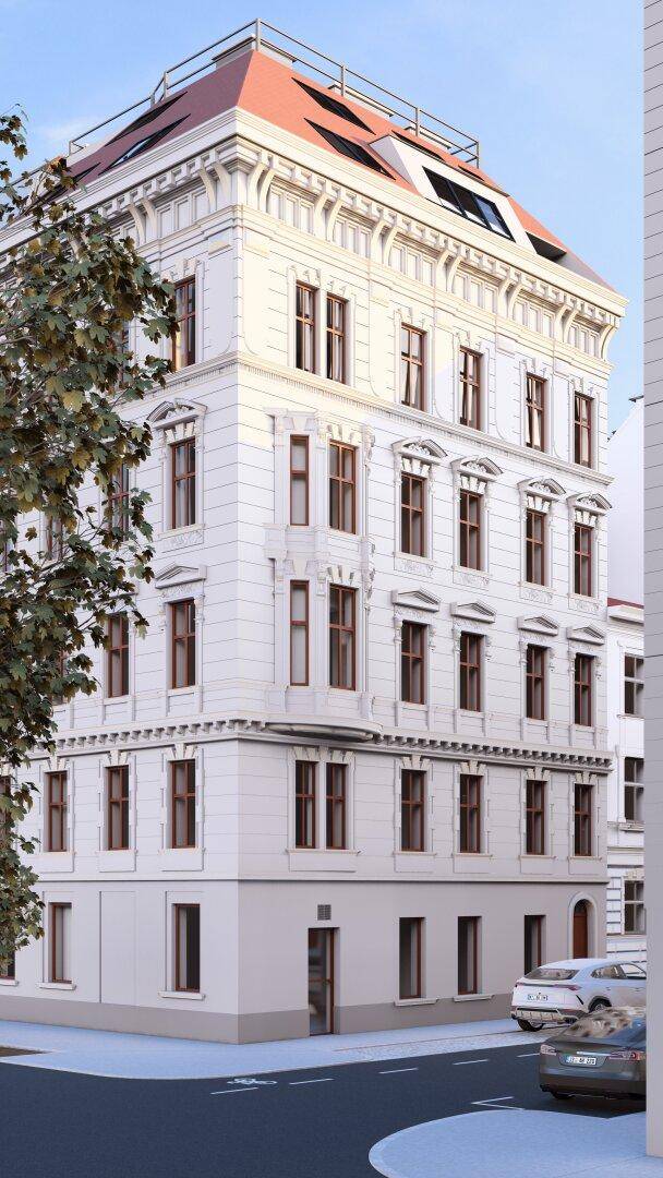 Stilvolles Eckgebäude mit klassischer Fassade und modernen Dachgauben in städtischer Lage.