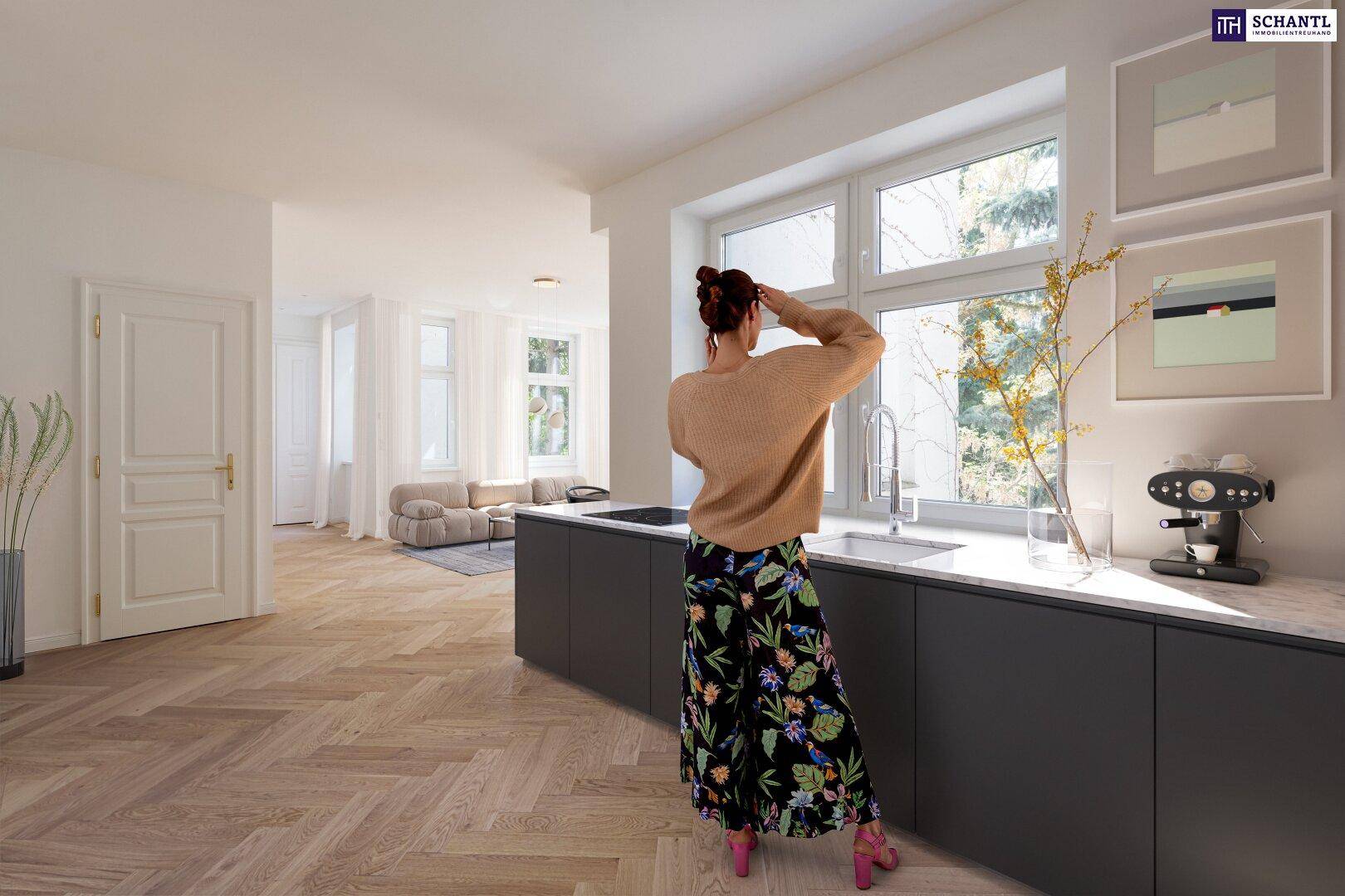 Moderne offene Küche mit dunklen Schränken, Marmorarbeitsplatte und Blick ins Wohnzimmer.