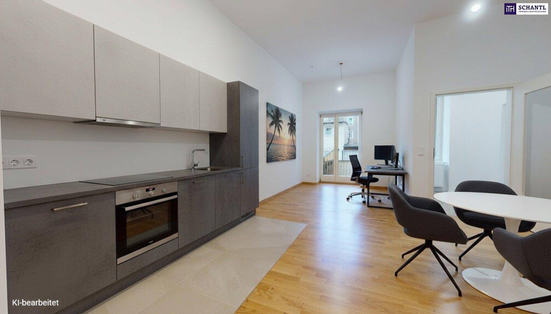 Moderne Küche mit grauen Schränken, Essbereich und Zugang zu einem Balkon.