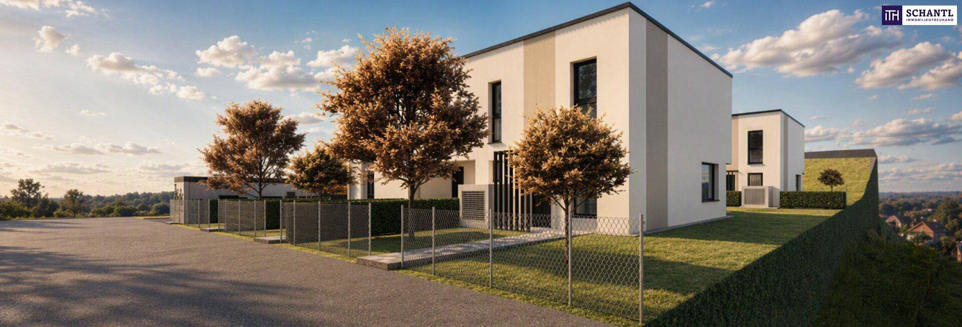 Moderne Reihenhäuser mit Flachdach und schlichter Fassade in einer Wohnsiedlung, umgeben von Bäumen.