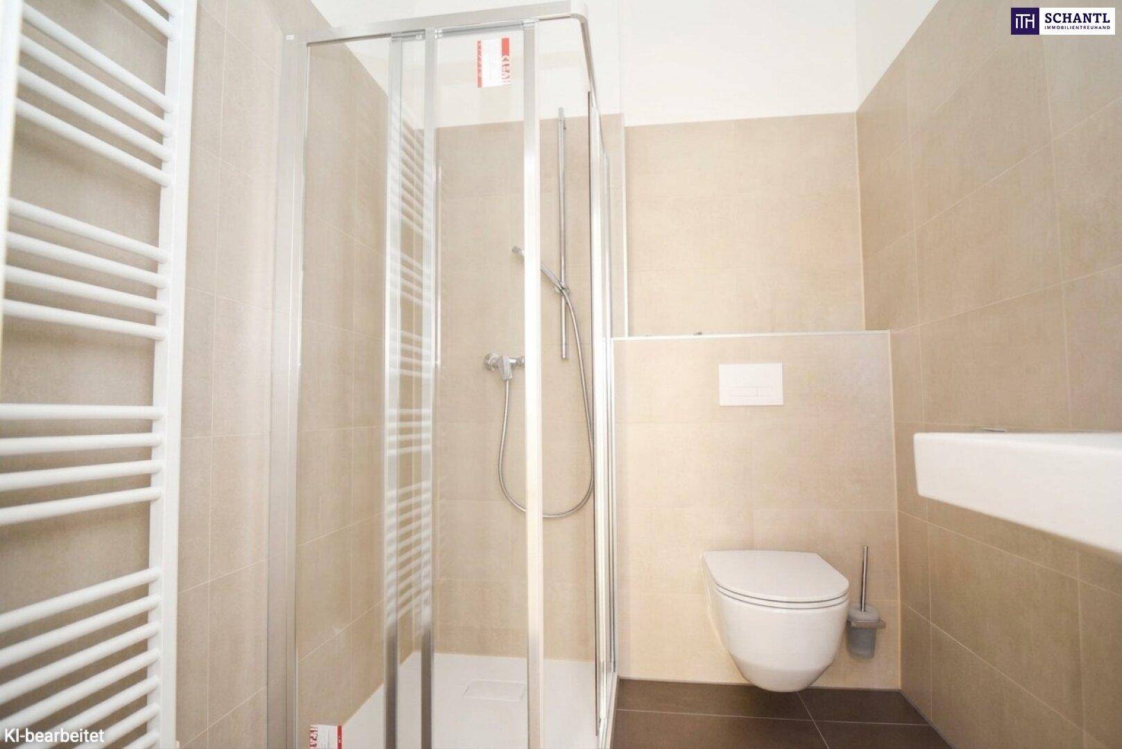 Modernes Badezimmer mit Duschkabine, wandhängender Toilette und Handtuchheizkörper.