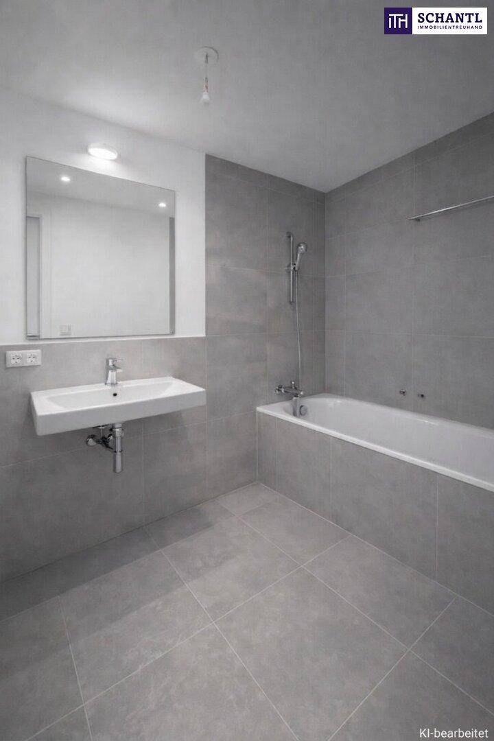 Modernes Badezimmer mit grauen Fliesen, wandhängendem Waschbecken und integrierter Badewanne mit Dusche.
