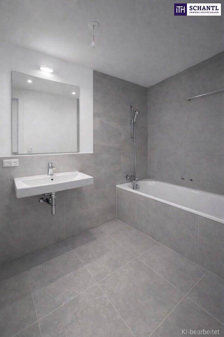 Modernes Badezimmer mit grauen Fliesen, wandhängendem Waschbecken und integrierter Badewanne.