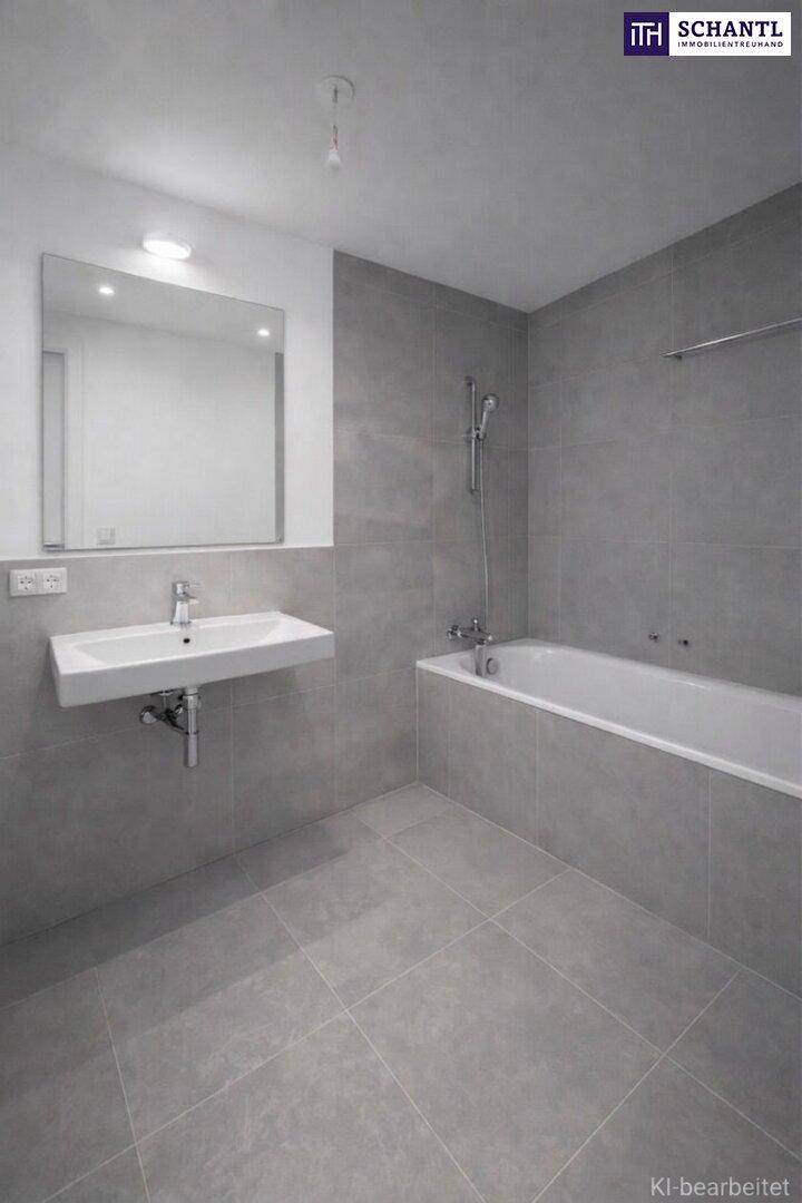 Modernes Badezimmer mit grauen Fliesen, wandmontiertem Waschbecken und integrierter Badewanne.