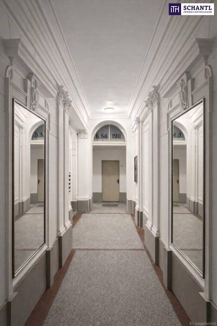 Prächtiger Flur mit hohen Decken, Stuckverzierungen und großen Spiegeln in einem Altbau.
