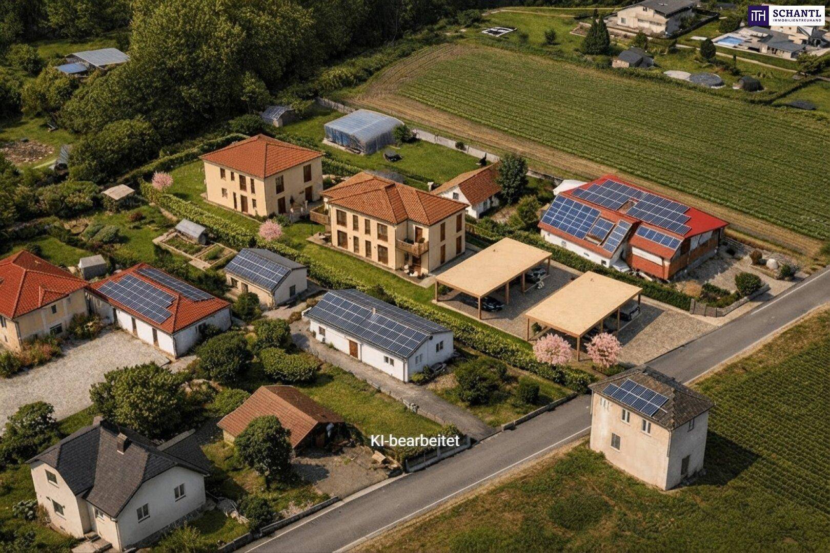 Überblick über eine ländliche Wohngegend mit Einfamilienhäusern, Solaranlagen und Feldern.