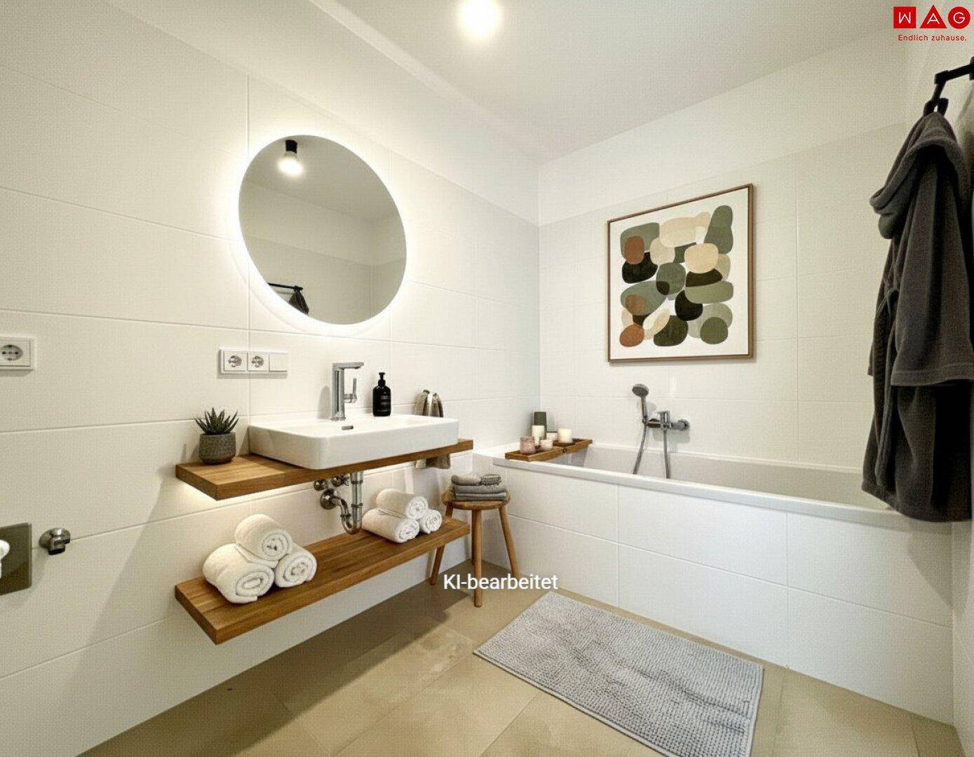 Modernes Badezimmer mit Badewanne, schwebendem Waschtisch und beleuchtetem Spiegel.