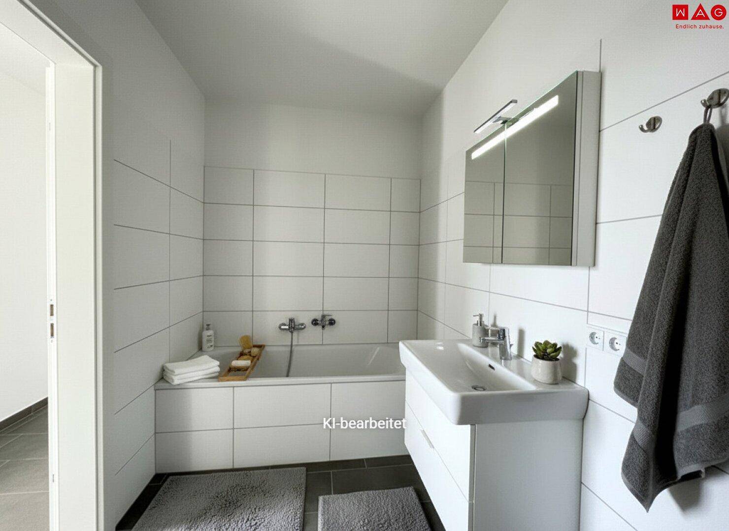 Modernes Badezimmer mit Badewanne, Waschbecken, Spiegelschrank und weißen Fliesen.