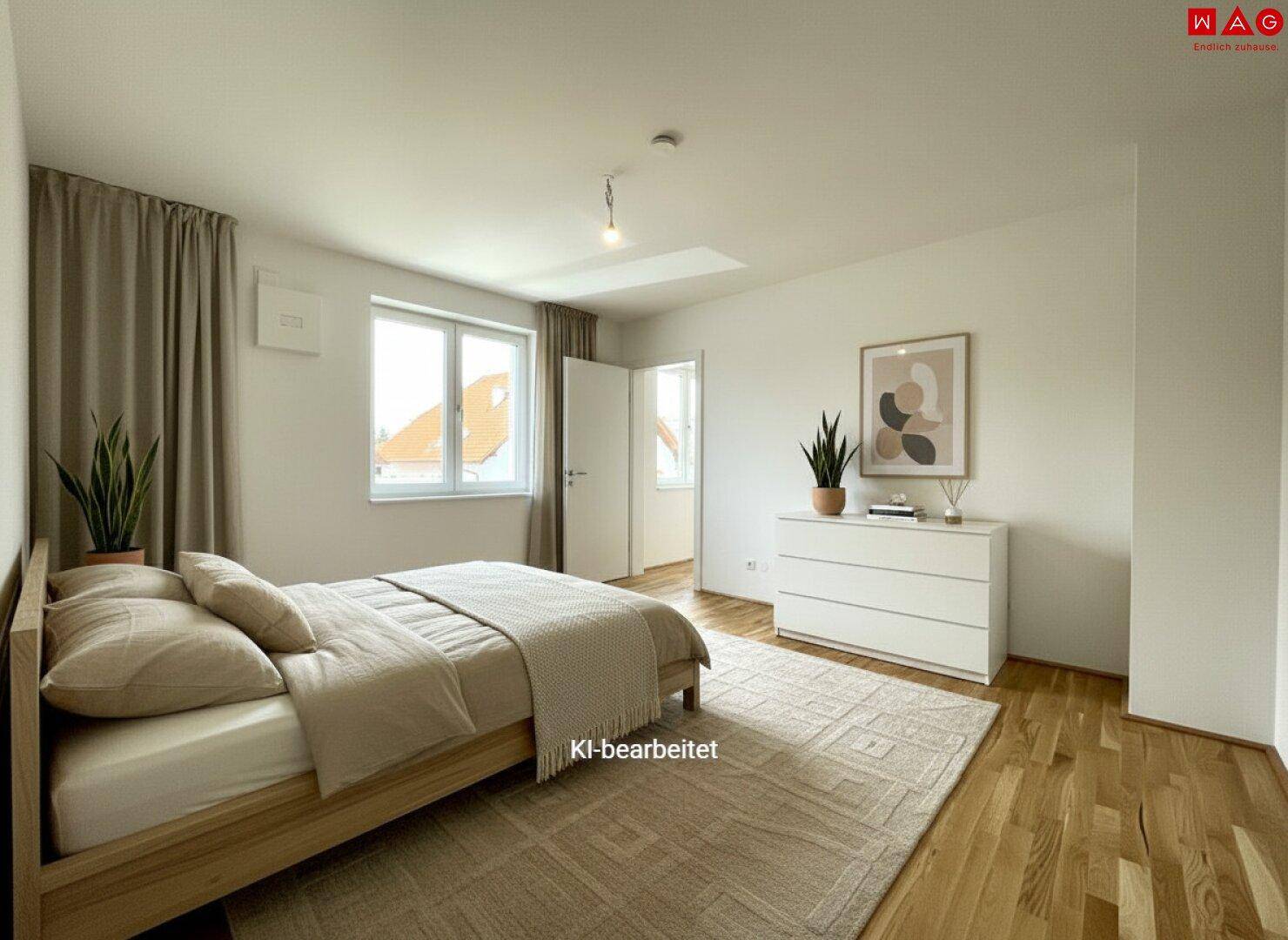 Helles Schlafzimmer mit Holzboden, modernem Bett und Blick ins Grüne.