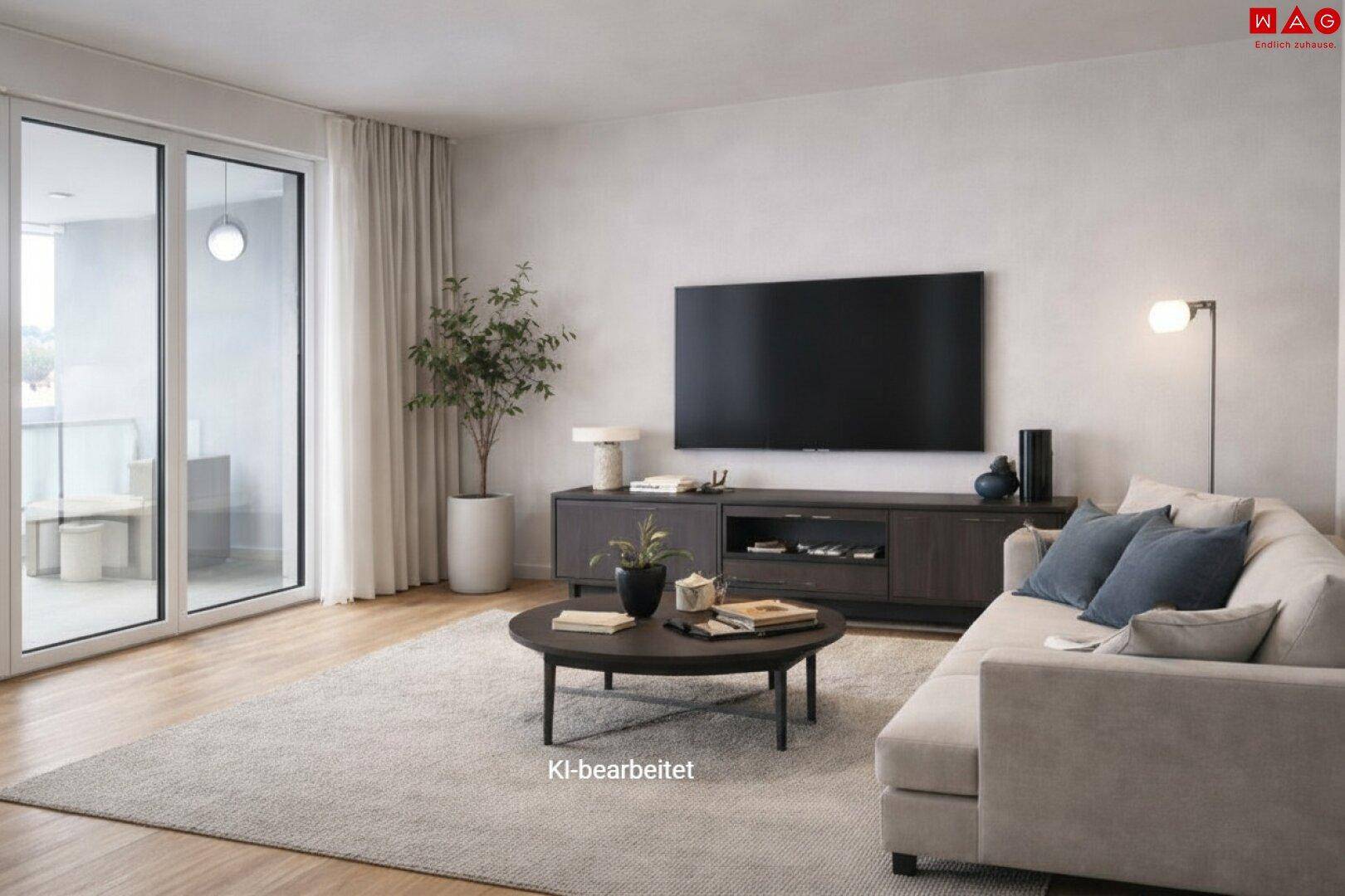 Helles Wohnzimmer mit Sofa, Couchtisch und großem Fernseher, mit Zugang zu einem Balkon.