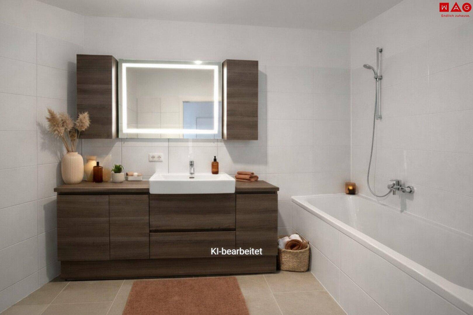 Modernes Badezimmer mit Badewanne, Waschtischunterschrank und beleuchtetem Spiegelschrank.