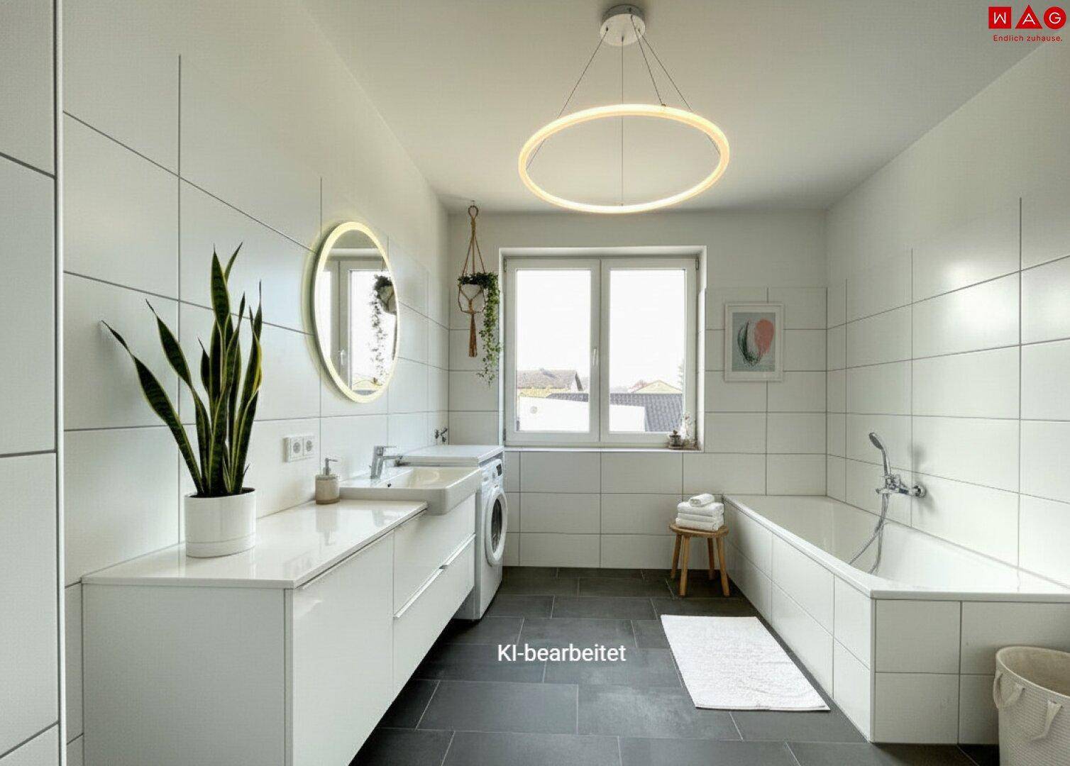 Modernes Badezimmer mit Badewanne, Doppelwaschbecken, Waschmaschine und großen weißen Fliesen.