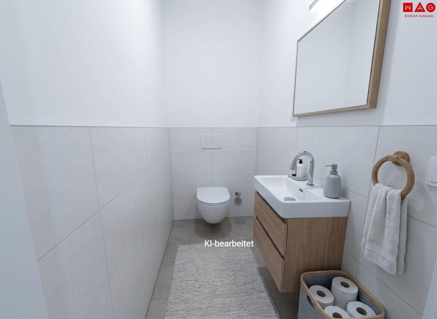 Modernes Gäste-WC mit Wand-WC, Einzelwaschbecken und hellen Fliesen.