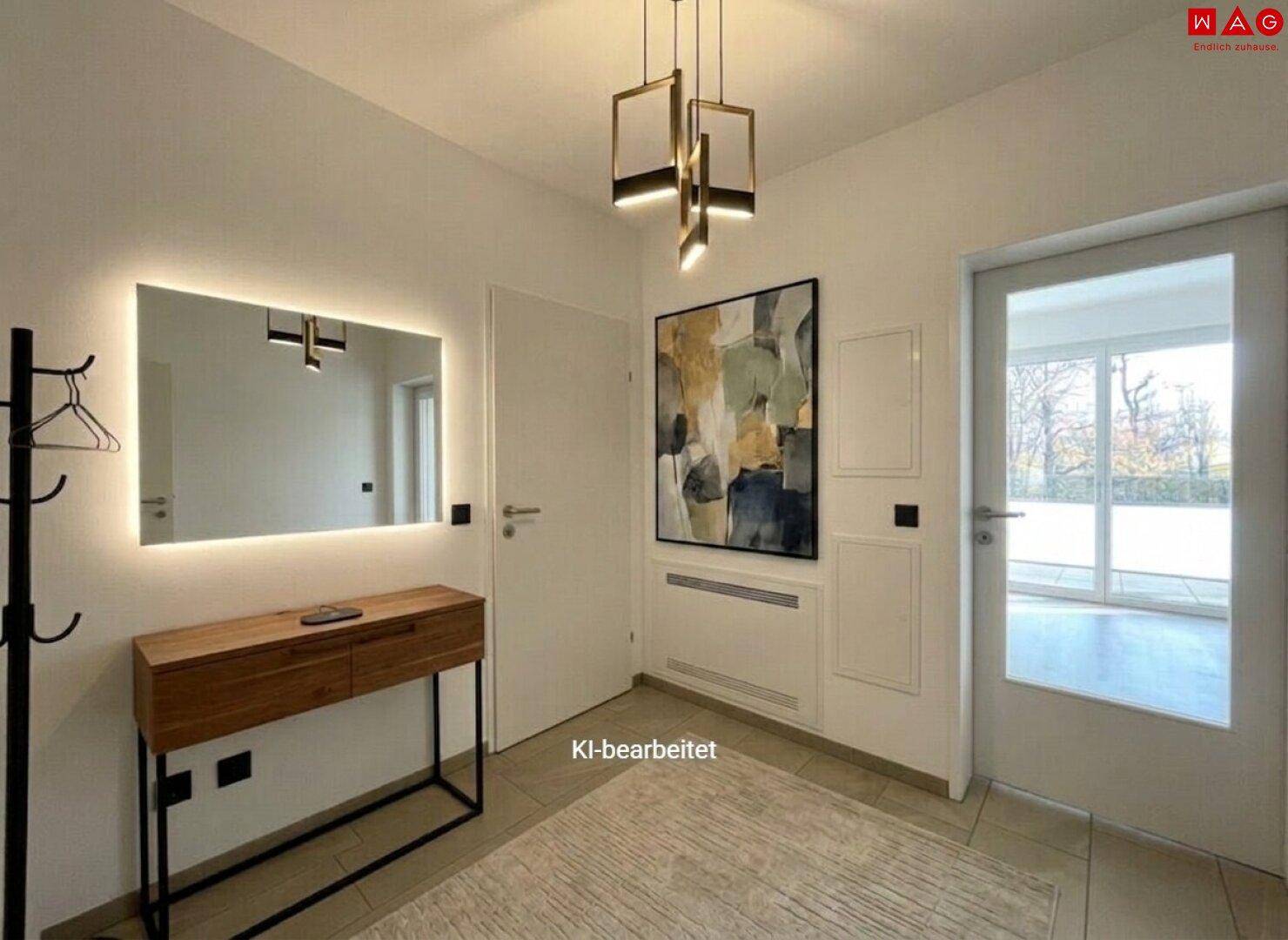 Moderner Eingangsbereich mit beleuchtetem Spiegel, Holzkonsolentisch und Fliesenboden.