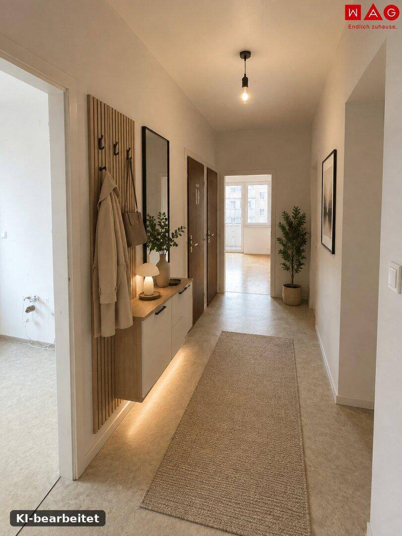 Modern gestalteter Flur mit Garderobe, Spiegel und indirekter Beleuchtung.