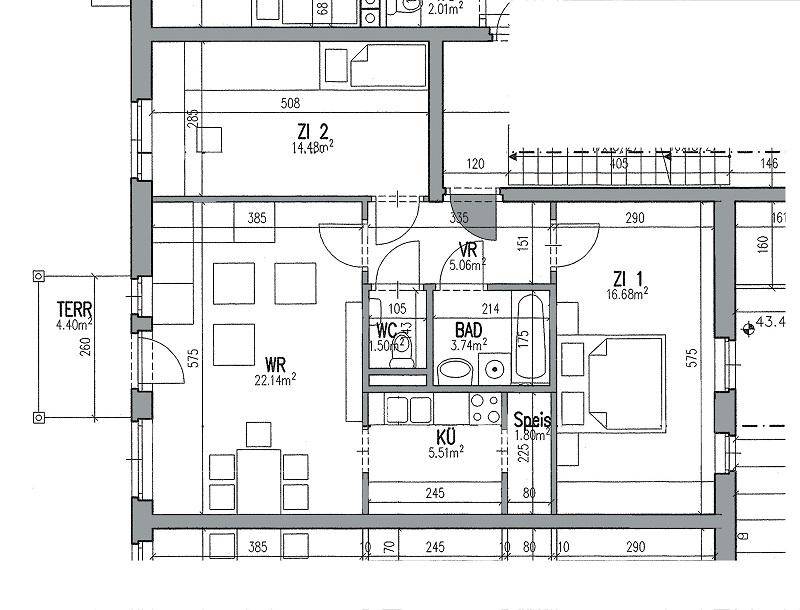 Grundriss einer Wohnung mit drei Zimmern, Küche, Bad, separatem WC und Terrasse.