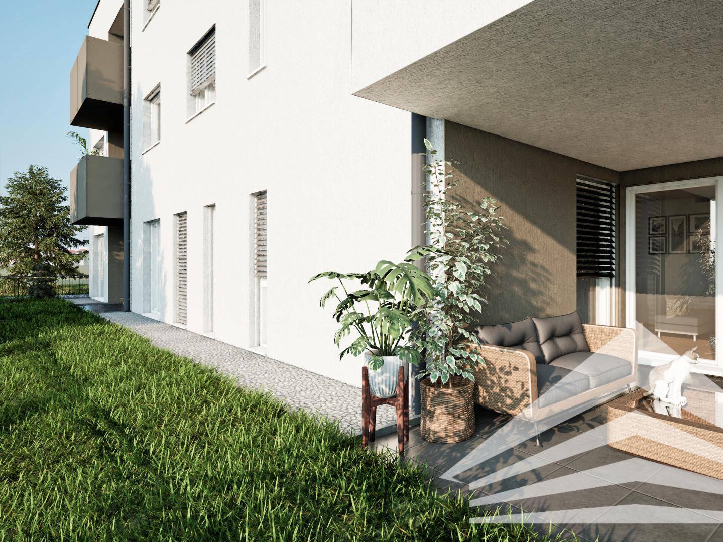 Erweiterter Blick auf den Balkon mit angrenzender Grünfläche und moderner Einrichtung.