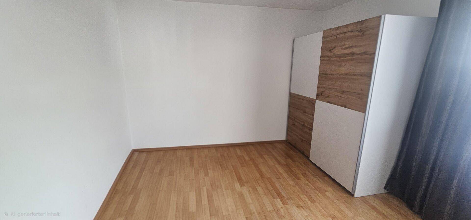 Schlafzimmer mit hellem Holzboden und einem modernen Kleiderschrank in Holz-Weiß-Optik.