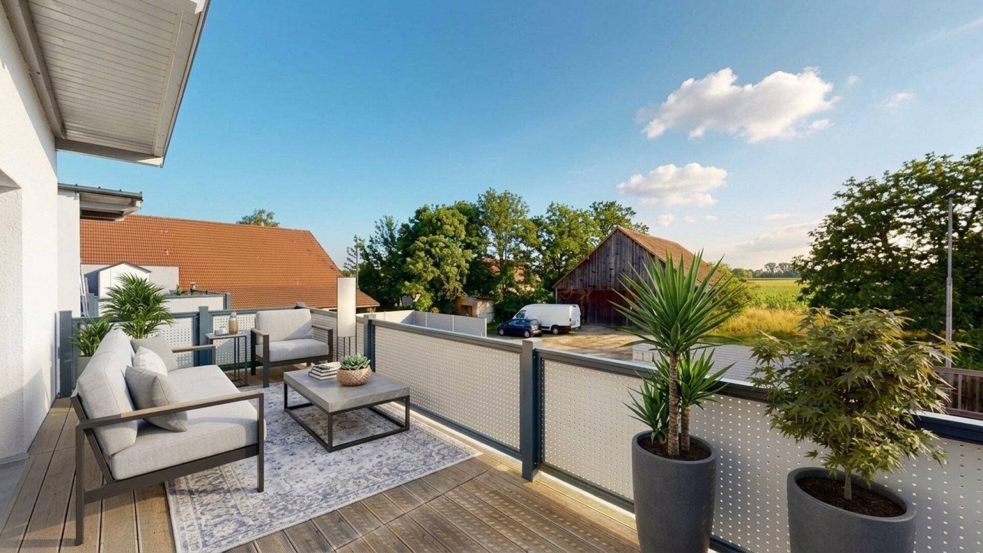 Möblierter Balkon mit Sitzgelegenheiten und Blick auf die ländliche Umgebung und einen Bauernhof.