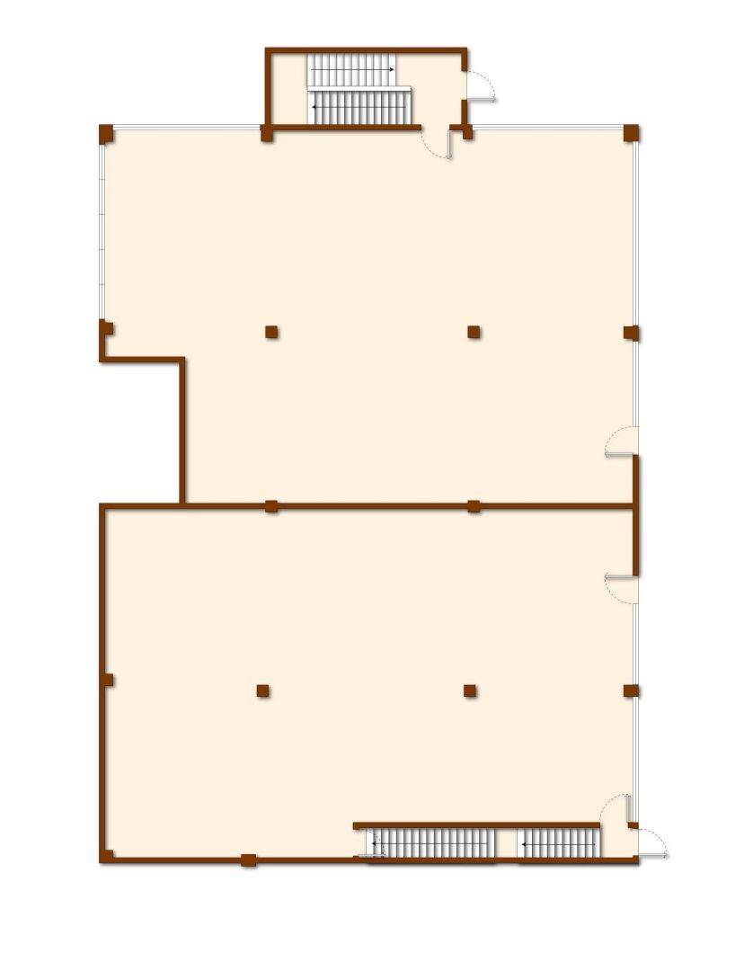 Grundriss einer großen, offenen Fläche mit zwei Treppenhäusern, ideal für gewerbliche Nutzung.