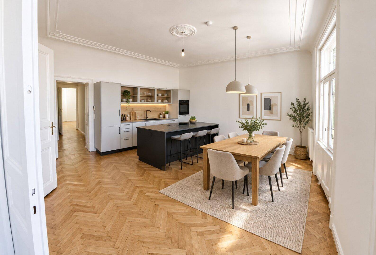 Moderne offene Küche mit Kochinsel und Essbereich, ausgestattet mit hochwertigen Geräten und elegantem Parkettboden.