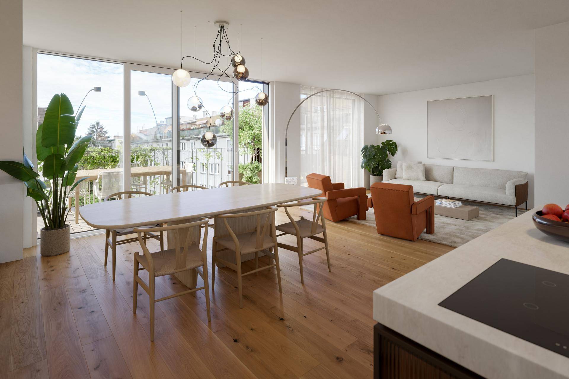 Geräumiger offener Wohn-Essbereich mit Holzboden, großen Fenstern und Zugang zur Terrasse.