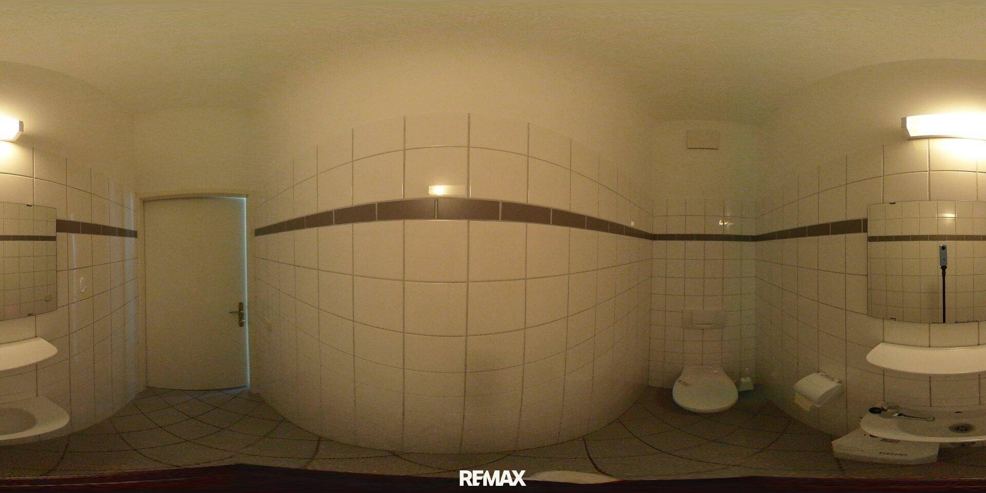 360-Grad-Innenansicht einer weiteren Toilette mit weißen Fliesen, WC und Waschbecken.