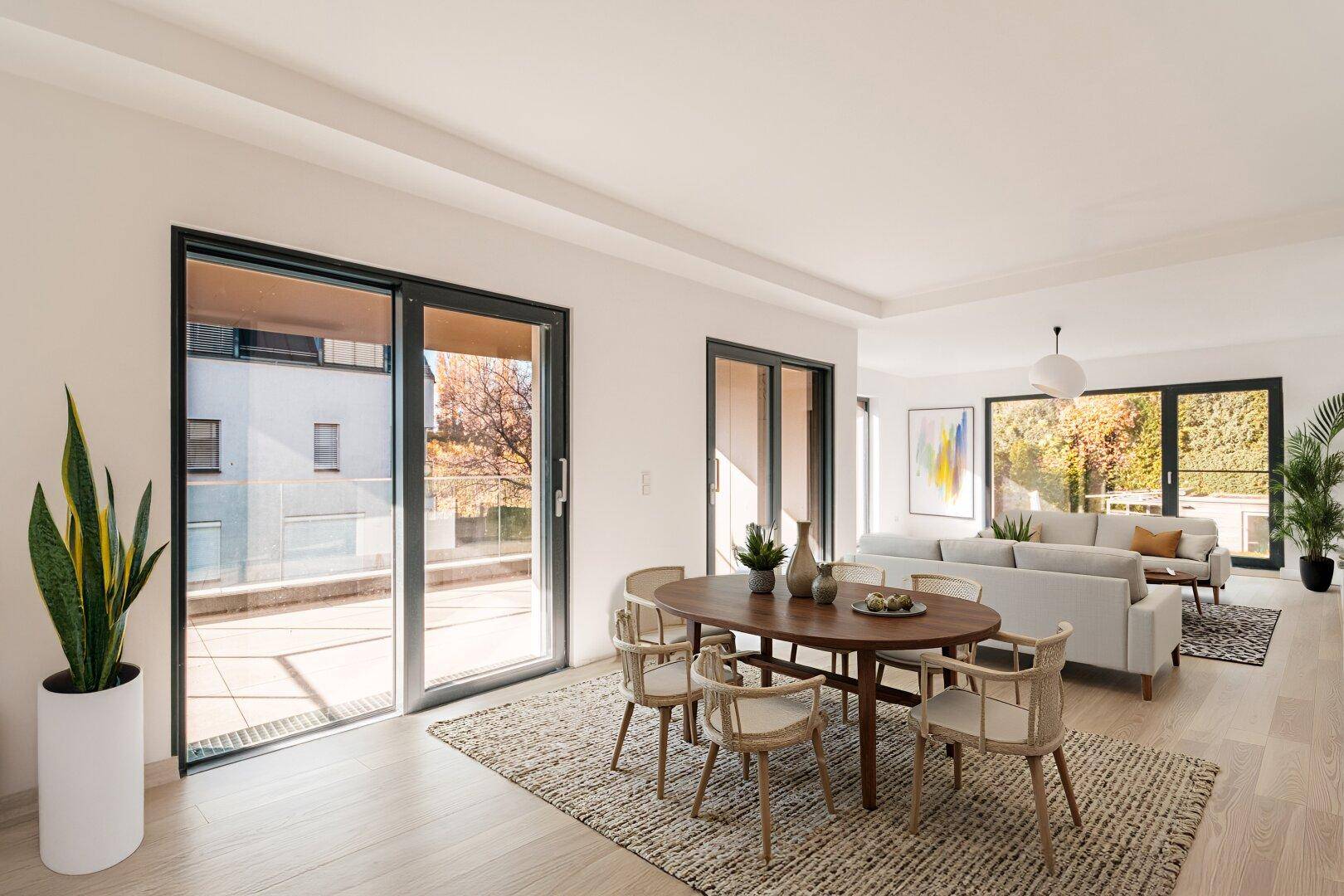 Heller, offener Wohn- und Essbereich mit Holzboden und Zugang zur Terrasse, modern eingerichtet.