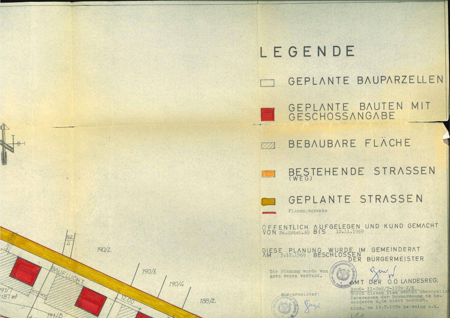 Legende eines Bebauungsplans mit Symbolen für geplante Baugrundstücke, Gebäude und Straßen.