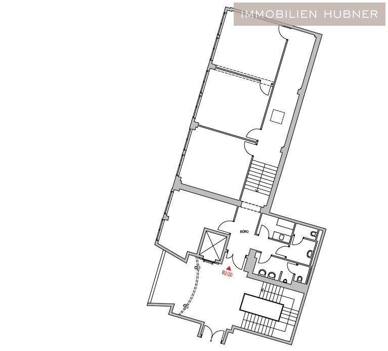Detaillierter Grundriss des Bürogebäudes mit verschiedenen Räumen und Treppenhäusern.